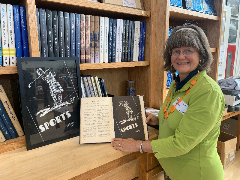 Charlene Craig with Her Father's 1938 Art Work and the Yearbook > Footsteps - Grossmont High School Museum