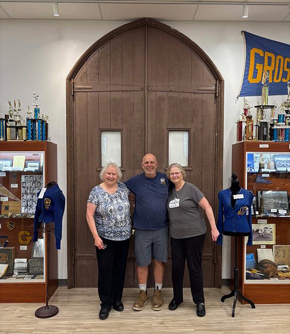 June 2025 Connie, wonderful district carpenter Tony Patton, and Lynn in front of the original doors
