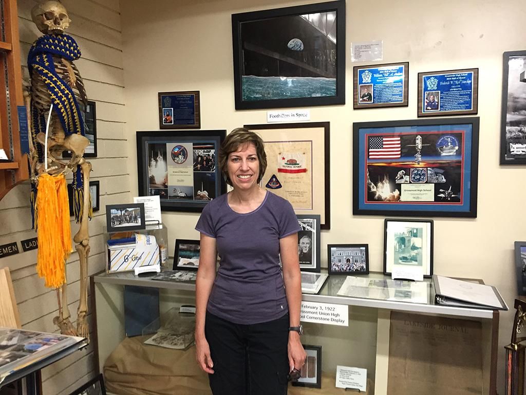 Ellen Ochoa in front of Astonaut Display, 2015